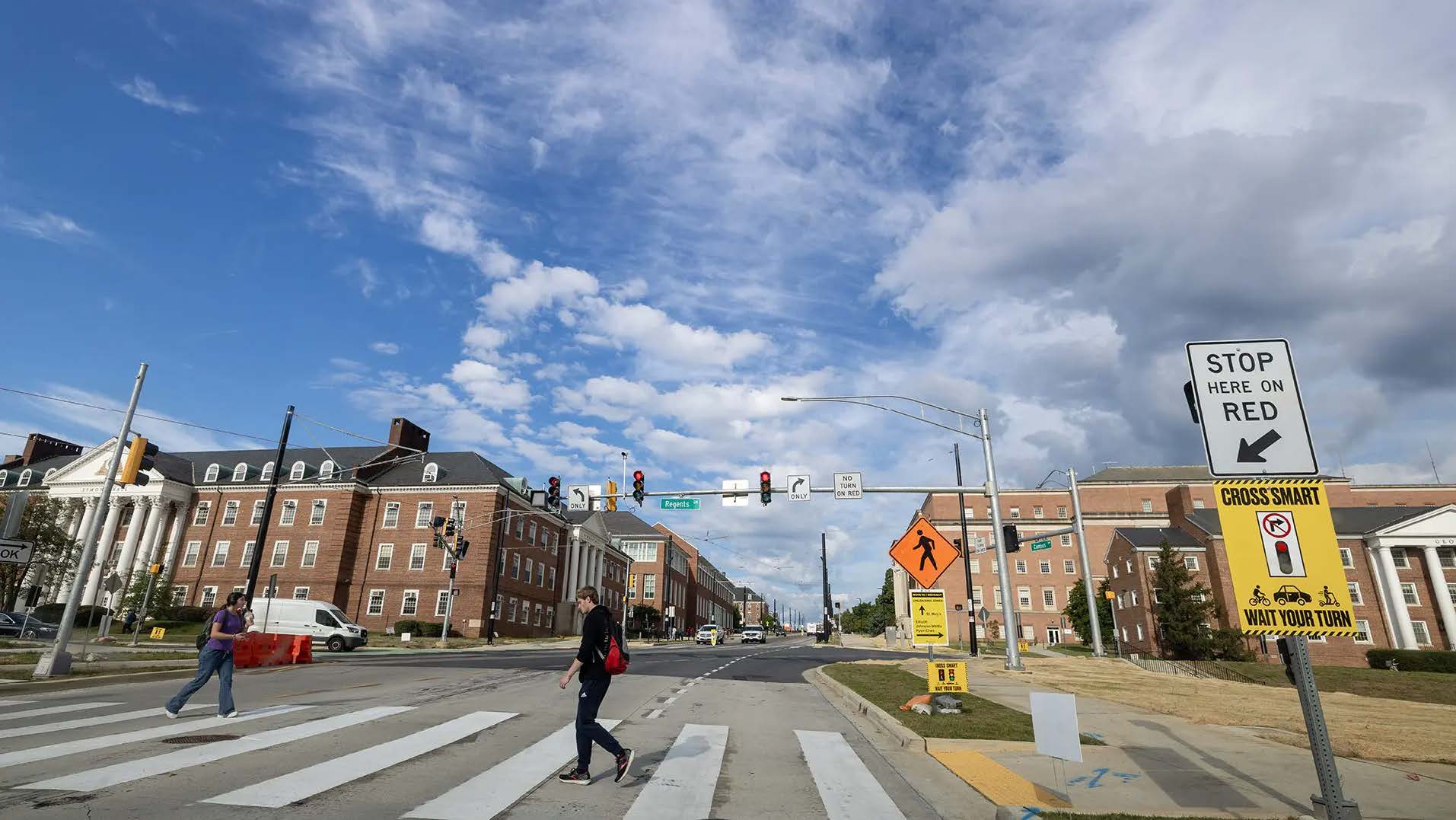Pedestrians, micromobility riders and drivers are all getting accustomed to new traffic patters resulting from the new signals the began operation July 31 at Campus and Regents Drives (Photo by John T. Consoli)